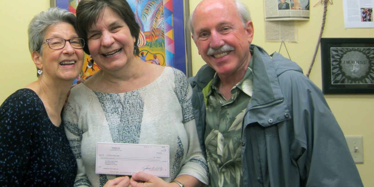 Marcy and Jim Lily present Executive Director Deb Green with a check from Cindy Days